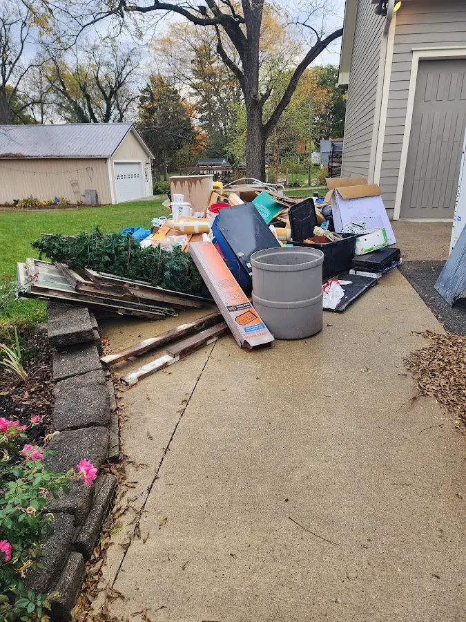 Dumpster being loaded with debris for Residential Dumpster Rental in Clarkston Heights-Vineland